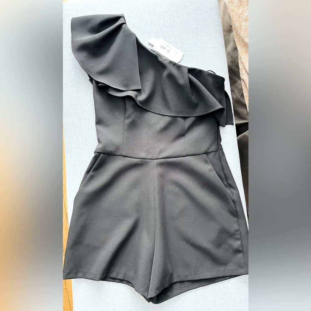 Aqua one shoulder romper. Brand new with tags.